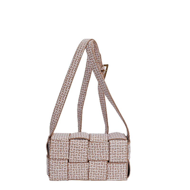 2025 nuevo otoño trenzado empalme de color sólido personalidad simple temperamento fresco estilo de hombro bolso de viaje