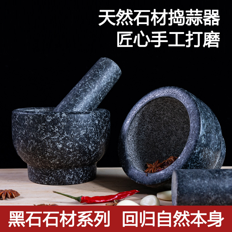 un cilindro de piedra negra tipo molino de piedra de grasa