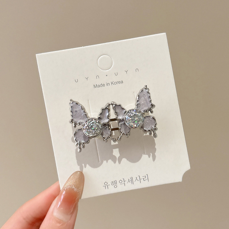 Horquilla de mariposa líquida de estilo dulce, flequillo lateral femenino de alto valor, diseño de nicho, clip lateral suave y versátil, horquilla