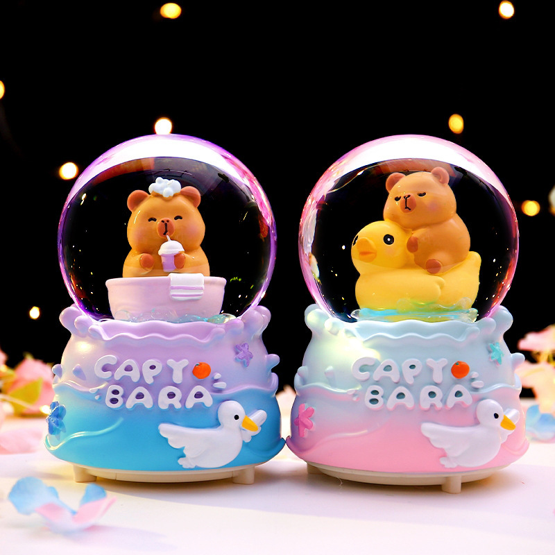 Red roja caliente Kapibala bola de cristal caja de música nieve que brilla estudiantes niños regalos navideños decoración de la habitación