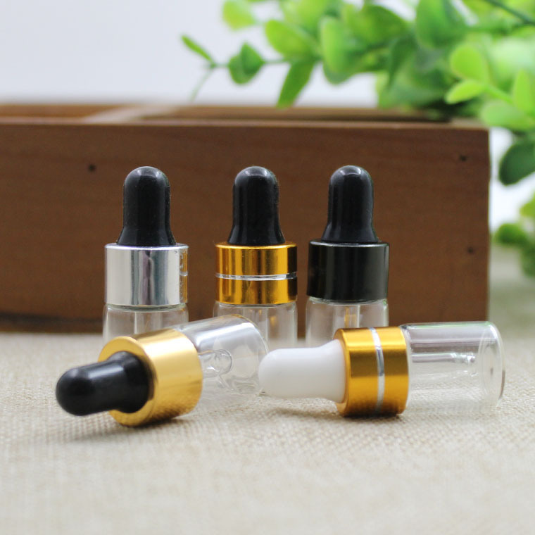 1ml de fábrica al por mayor botella de aceite esencial transparente tangente oro blanco pegamento cabeza cuentagotas botella de vidrio botella pequeña muestra botella sub-botella