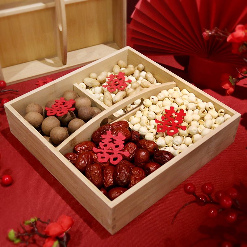 A wholesale wedding supplies collection including bamboo birth luck auspicious boxes, wedding decorations, bed pressing ornaments, and dried fruit trays.