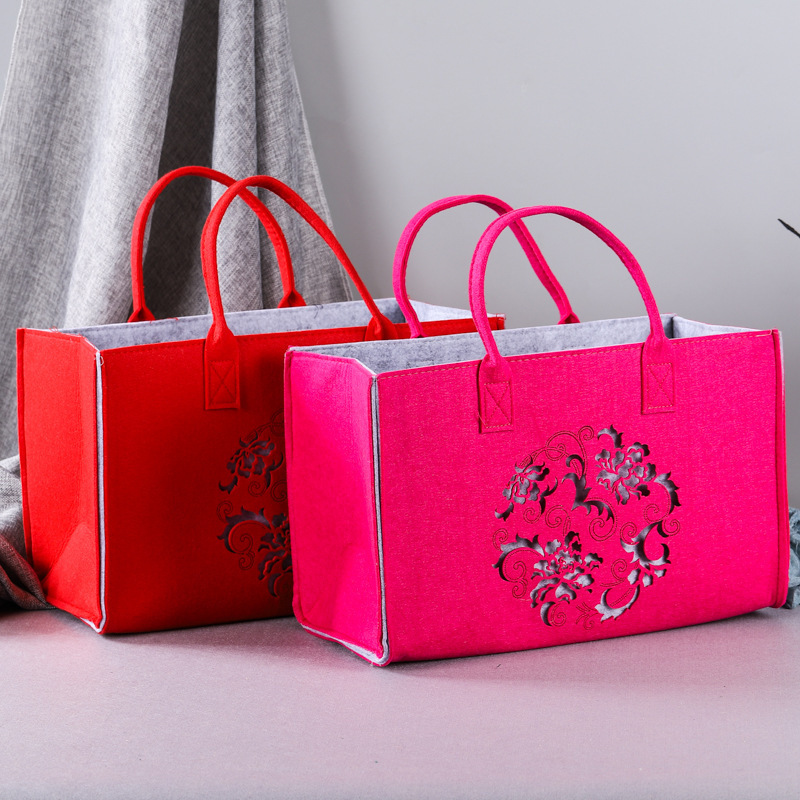 激光雕花镂空礼品袋创意手提包简约毛毡有底有侧广告袋厂家批发