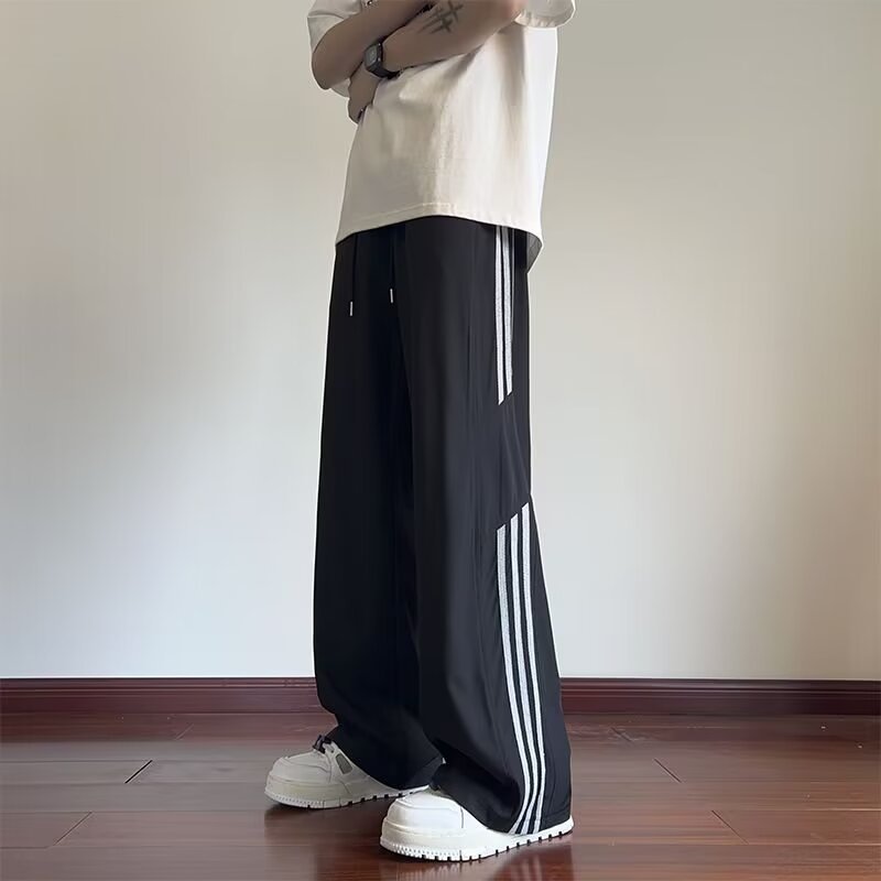 ストライプの氷糸のズボンの男性の夏の薄いタイプの青少年の百合のゆったりしたデザイン感のまっすぐな筒の広い足の運動の長いズボン|undefined