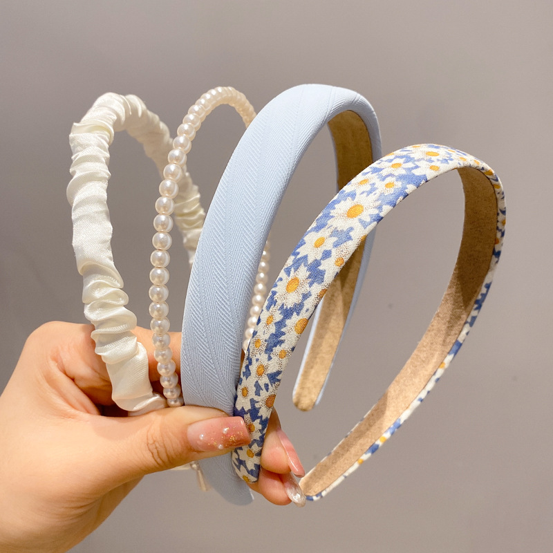 A principios de la primavera, la banda de cabello para mujeres en línea, 2025 nuevo lavado de cara de presión de tarjeta de cabello para el cabello, banda de cabello de perlas, banda de cabello para mujeres.