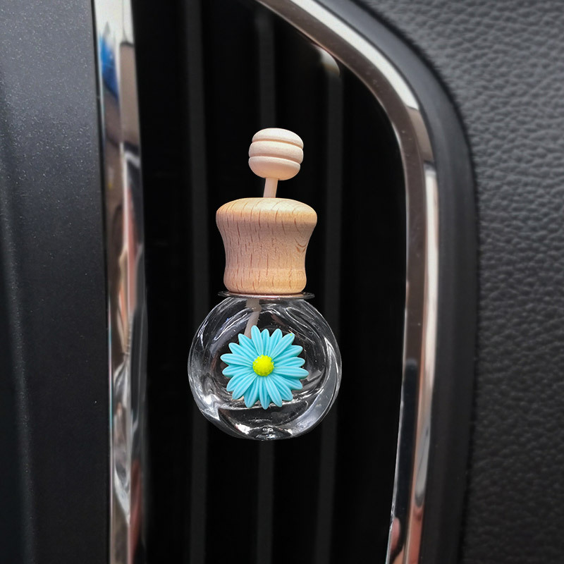 Pequeña margarita salida de aire botella de perfume de coche botella vacía flor de sol botella de aromaterapia de coche decoración de coche creativo