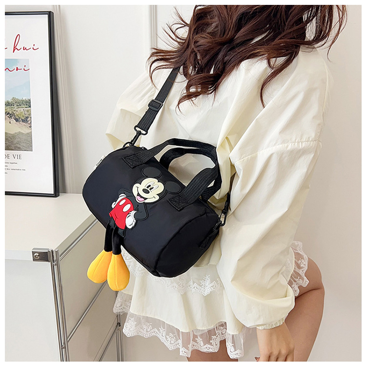 The 2021 new children's bags feature a cute Mickey Mouse pattern bowling bag for girls and a fashionable hand-held shoulder bag undefined