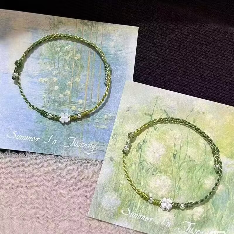 Xiaohongshu's Popular Green Four-Leaf Clover Butterfly Wax Thread Braided Bracelet for Women, Fashionable and White Design, Versatile Luxury Product