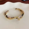 Golden fuchsia black bracelet