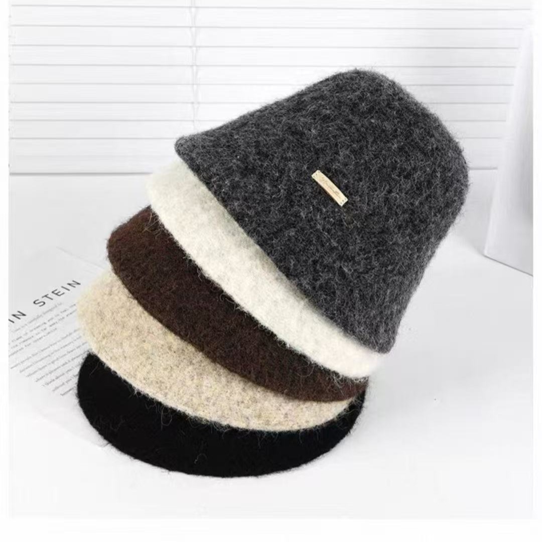 Francia elegante sombrero de pescador blanco para mujeres otoño y invierno 2025 nuevo estilo artístico para mostrar la cara pequeña sensación simple sombrero de cubo de agua universal