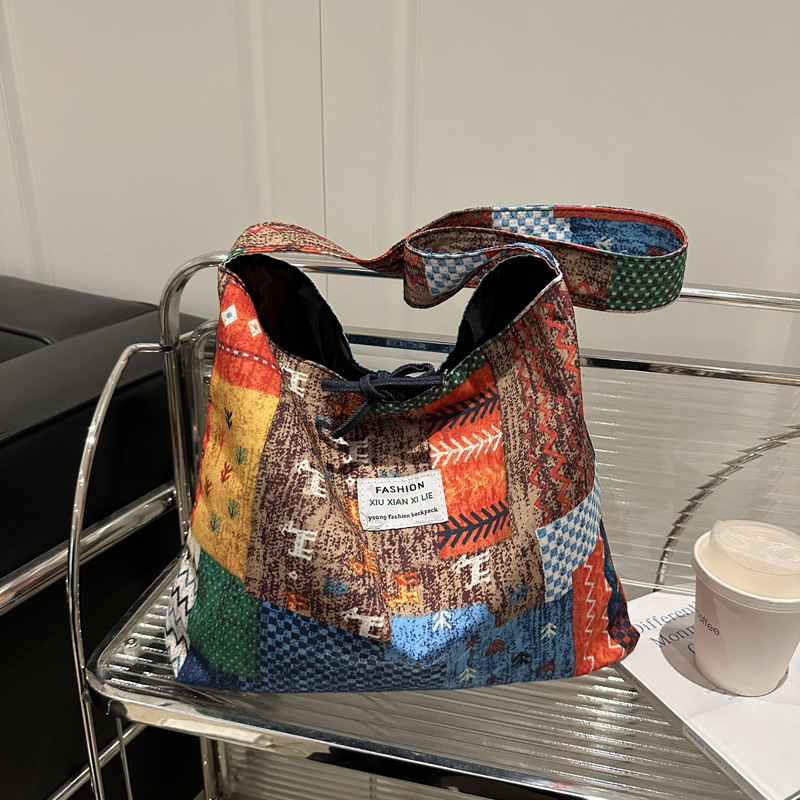 2025 primavera y verano estilo nacional denim tendencia nueva mochila de hombro de gran capacidad mochila de pulsación de la moda