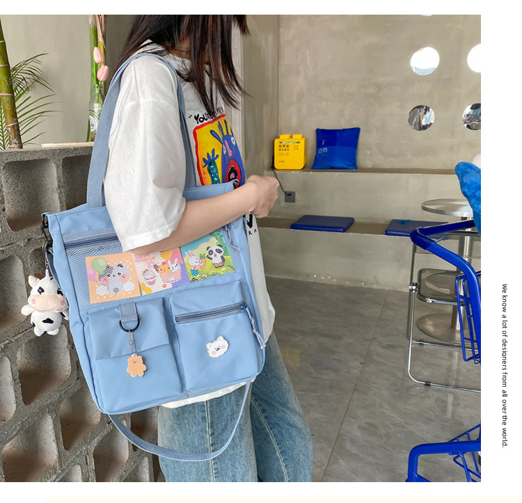 Large-capacity Japanese-style single-shoulder canvas bag for girls, versatile crossbody, ins, a tote bag for junior high school students' classes, and a schoolbag for after-school tutoring Item Picture