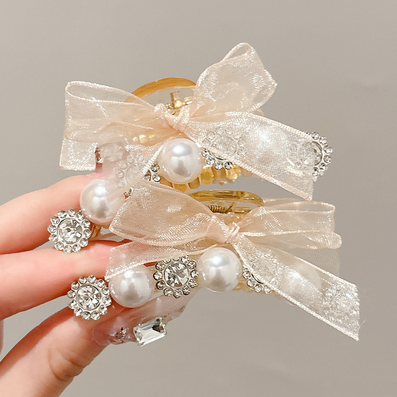 3 # Un par de pinzas de diamantes de imitación de perlas de champán