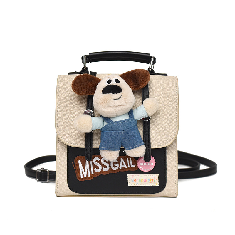 2026 nueva muñeca mochila de dibujos animados mujer textura mochila portátil nicho de viaje diario lindo bolso pequeño
