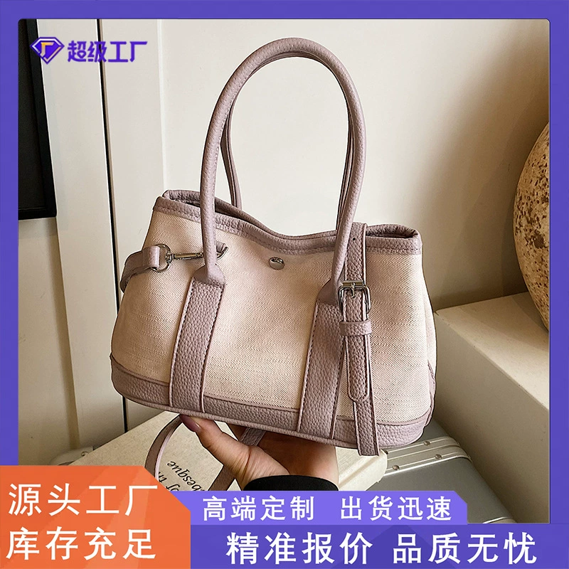 2025 Корейский новый нишевый дизайн, простая повседневная портативная сумка-ведро для женщин, персонализированная однотонная сумка через плечо