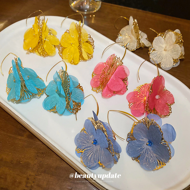 Pendientes de flores de moda coreana de nuevo estilo femenino fresco niña vacaciones viento gancho de oreja temperamento femenino pendientes de nicho de alto nivel