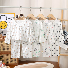 夏の子供の半袖セットの男女の目の速乾のエアコンの家庭服のセットの漫画のプリントの湿っている子供服