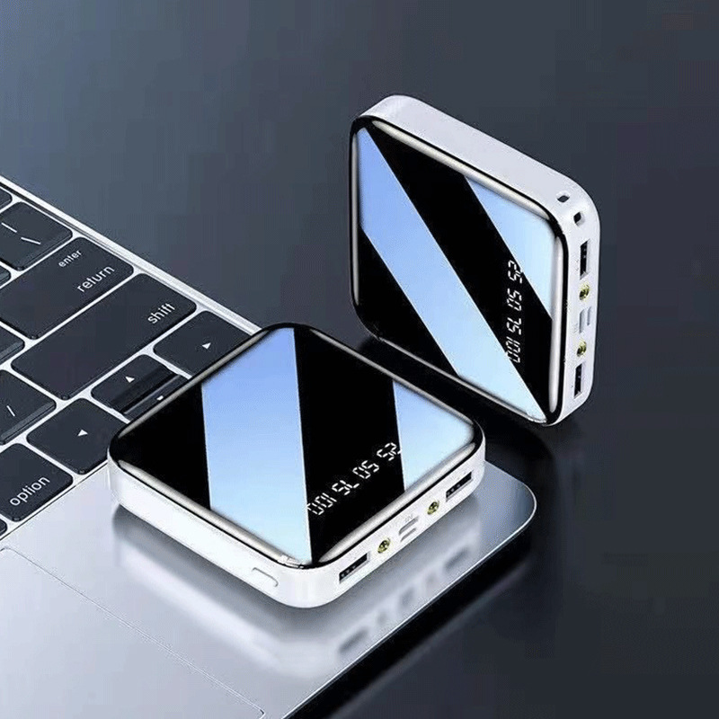 Lámpara LED de visualización digital espejo de doble puerto 20000 mAh compartido teléfono celular cargador al aire libre fuente de alimentación portátil en stock