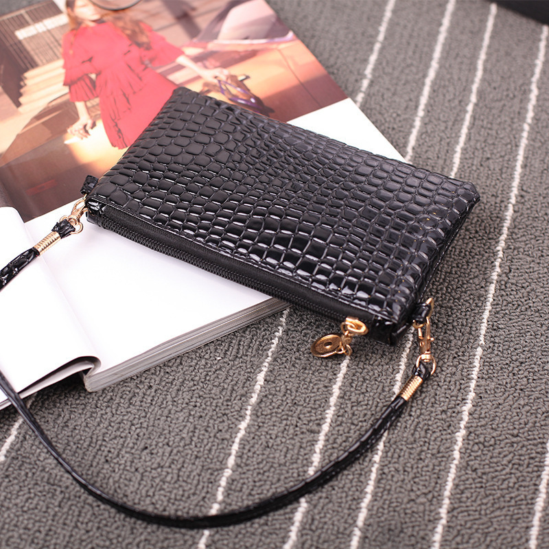 Una bolsa de mujer, bolso de moda 2024 bolso de hombro de mujer, bolso de tela de cocodrilo, bolso de cambio de teléfono móvil