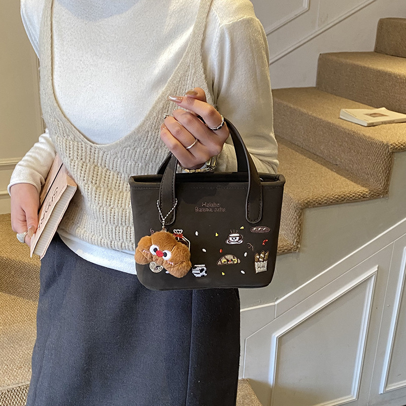2026 nuevo comercio exterior bolsas de niños dibujos animados lindos colgantes de peluche bolsas de mano bordadas de moda bolsas de hombro para hombres y mujeres