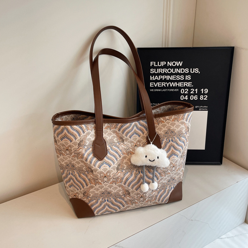 Nueva bolsa de hombro de gran capacidad de estilo chino para mujeres 2024 otoño nuevo estilo de alta calidad de impresión de patrón de montaña y mar bolsa especial