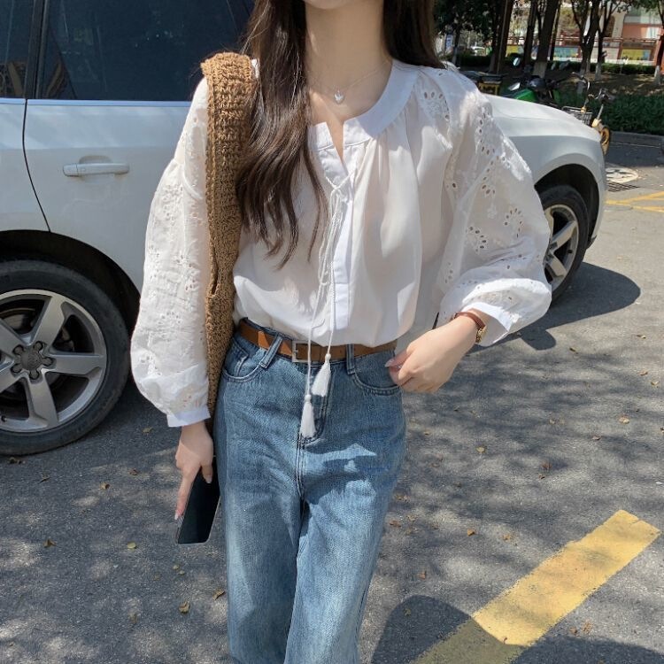 French-Style Long-Sleeved White Shirt with a Stylish 2026 Design, Featuring Hollow Lace Embroidery, Lace-Up, and Tassels French-Style Long-Sleeved White Shirt with a Stylish 2026 Design, Featuring Hollow Lace Embroidery, Lace-Up, and Tassels