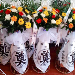 清明の花のかごは字の包装の紙を創立してお墓を祭って花輪の棚の冬至の花屋の花の芸の包みの材料を哀悼します。