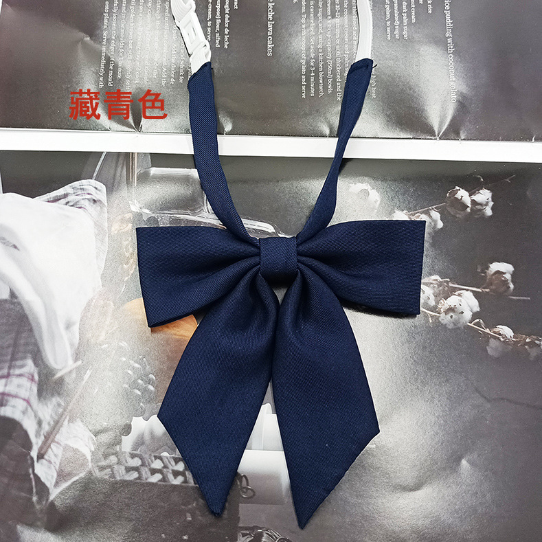 Spot al por mayor versión estrecha niña pequeña pajarita de raíz de plumas pajarita flor moda nuevo lazo color sólido jk pajarita satinado