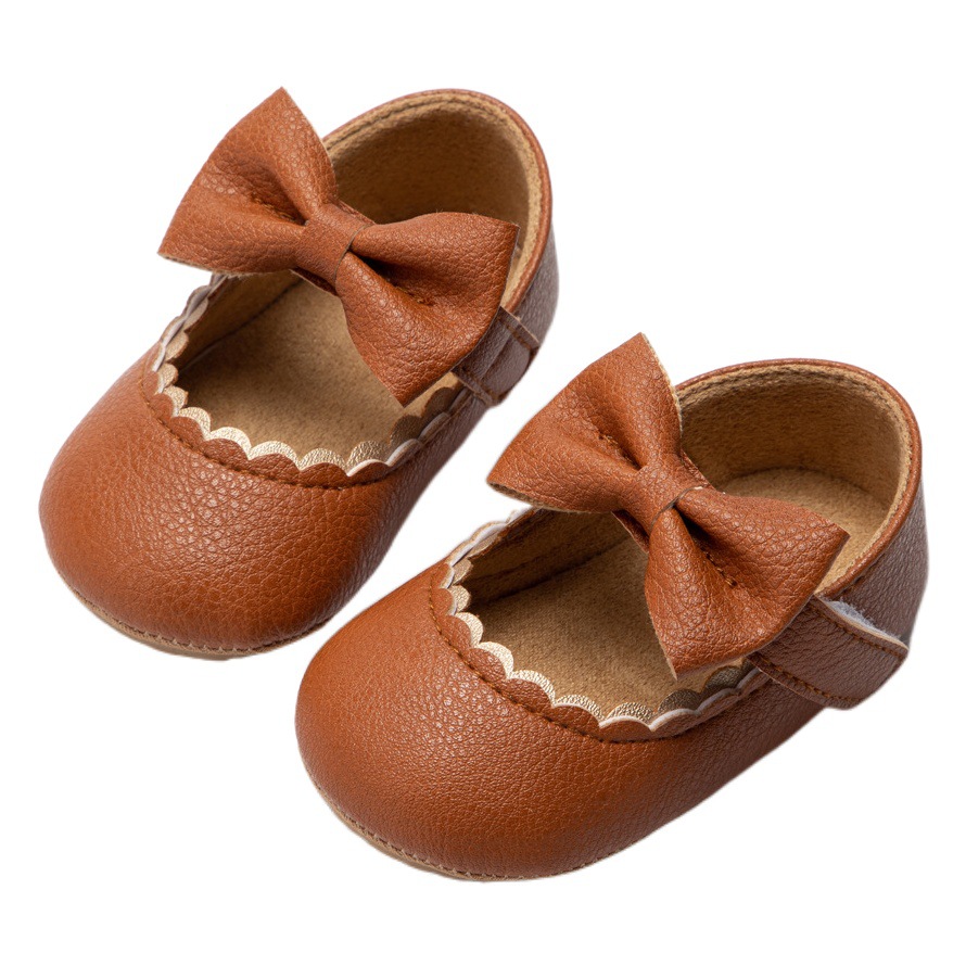 Zapatos de bebé populares de comercio exterior zapatos de princesa arco suela de goma zapatos de bebé antideslizantes zapatos de niño zapatos de niños zapatos de bebé