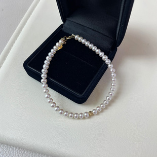 3-4mm freshwater baby bead pearl bracelet is basically round and almost flawless. A small 18K gold ball in the middle