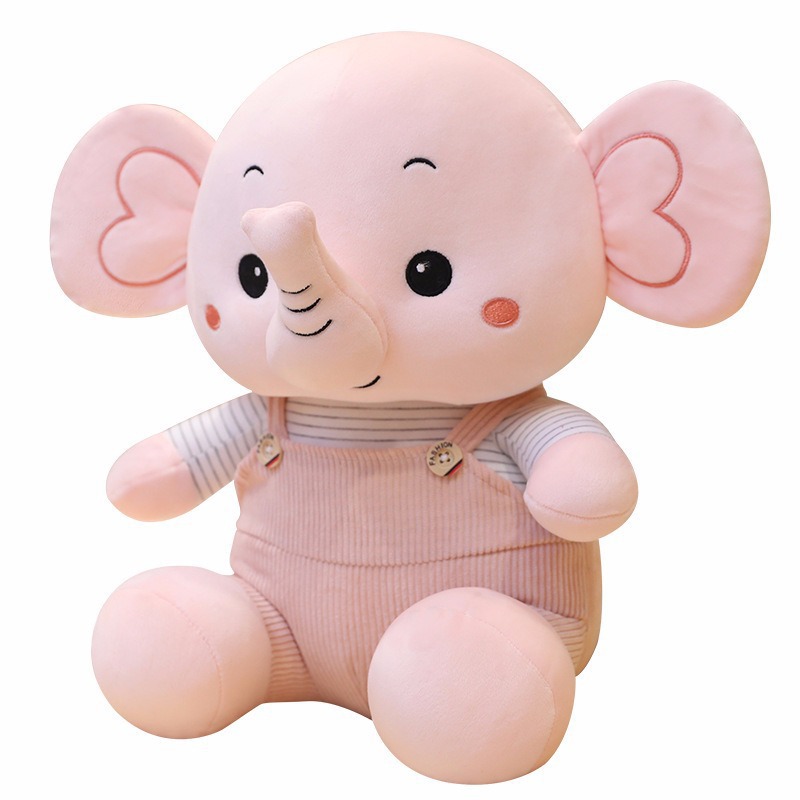Caricatura muñeca elefante muñeca muñeca de peluche muñeca elefante muñeca niños calmar muñeca almohada en la cama