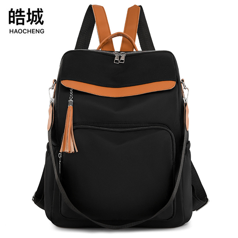 Comercio exterior al por mayor primavera nuevo estilo casual damas Oxford color contraste mochila simple y versátil multifuncional de doble uso