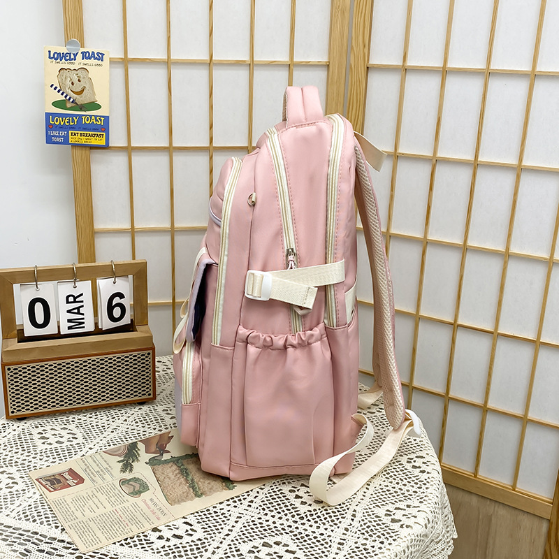 Mochila escolar 2024 mochila de estilo nuevo todo fósforo ocio para estudiantes de secundaria y preparatoria Mochila de viaje de color de contraste simple y de gran capacidad