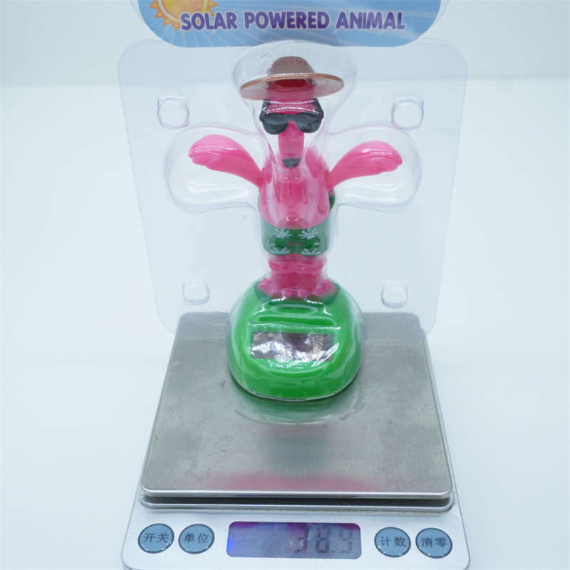 Venta caliente transfronteriza muebles oficina creativa flamenco balanceo animal sacudiendo la cabeza muñeca decoración de coche regalo de dibujos animados