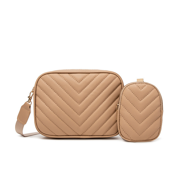 Bolsas de mujer al por mayor transfronterizas 2025 primavera y verano nueva bolsa de moda versátil bolsas de cámara de patrón en V cadena bordada bolsas de mochila