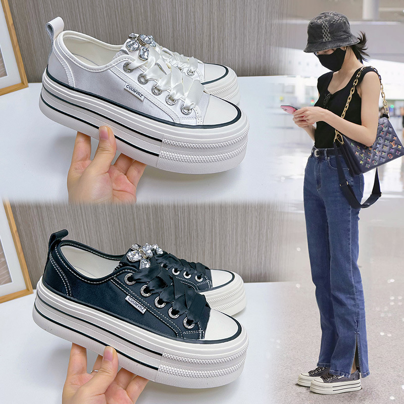 Fashionable white sneakers with rhinestones platform