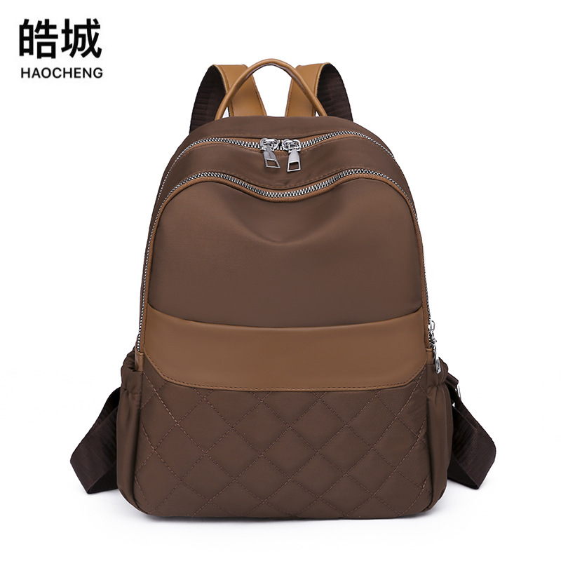 Mochila de nailon para mujer 2022 nueva mochila casual para mujer mochila de viaje de arte simple mochila escolar de moda al por mayor