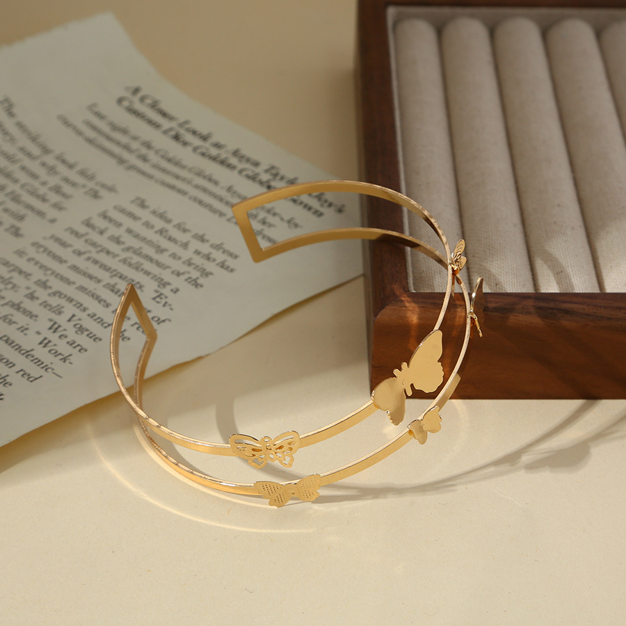 Amazon suministro directo pulsera de moda europea y americana simple anillo de brazo hueco mariposa brillante metal geométrico pulsera de brazo personalizada