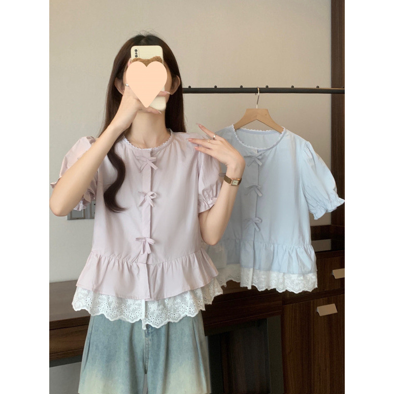 Short elegant shirt with a round collar with bow