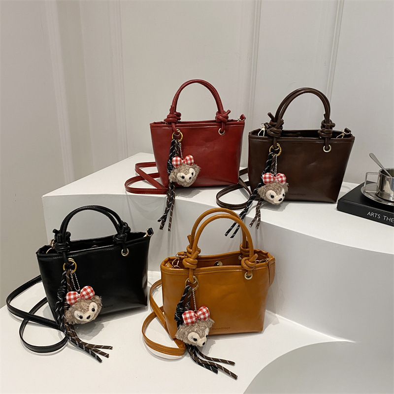 Bolso de moda simple 2024 invierno nuevo estilo retro textura bolso de cubo de moda color sólido viaje mochila de hombro