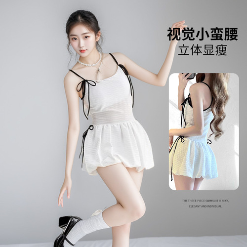 Ladies' French-style white one-piece strap swimsuit with conservative coverage for a slimmer and elegant vacation look