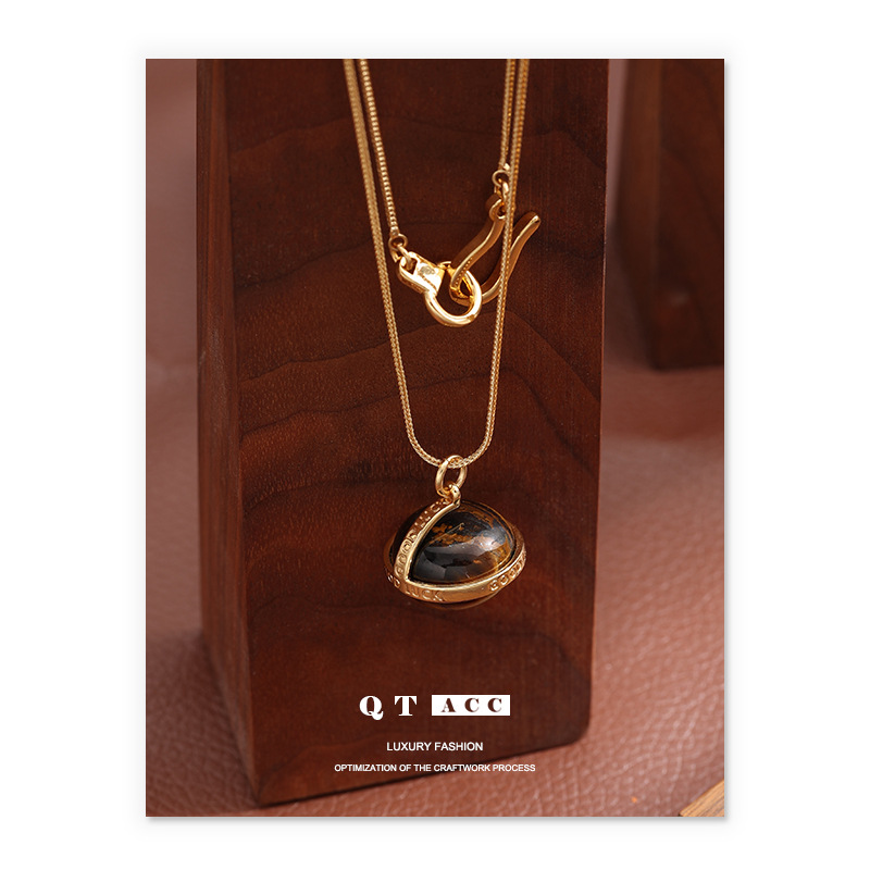 Transición fronteriza de moda europea y americana Mirad retro collar de piedra de ojo de tigre simple ligero lujo de alto nivel cadena de suéter largo otoño invierno