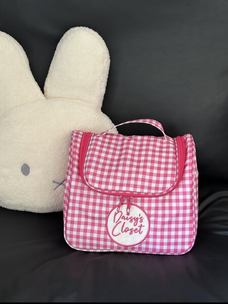 Capacious handheld cosmetic bag to go out