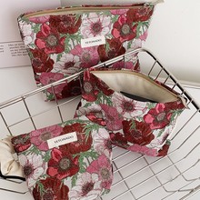 新款高级感文艺提花化妆包女士花朵手拿包高颜值便携收纳包零钱包