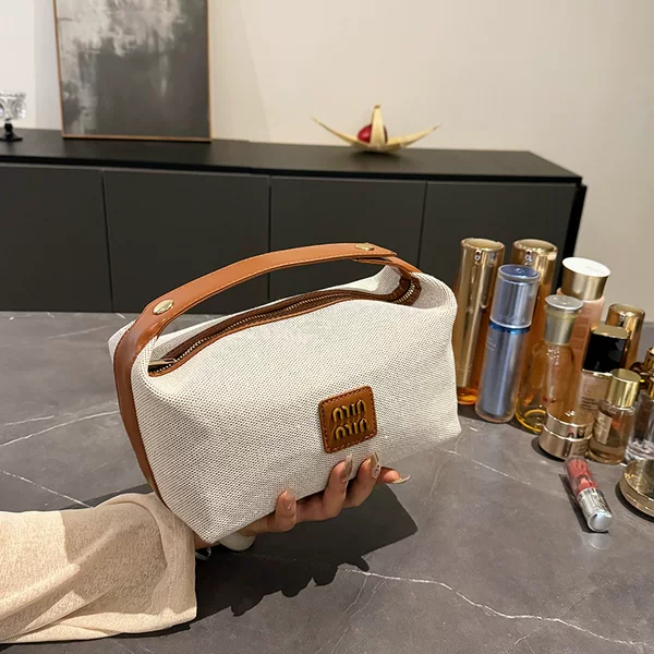 2026 Cross-Border Amazon New Product Metal Label Retro Light Luxury Canvas Handbag Makeup Bag High-End Storage Bag