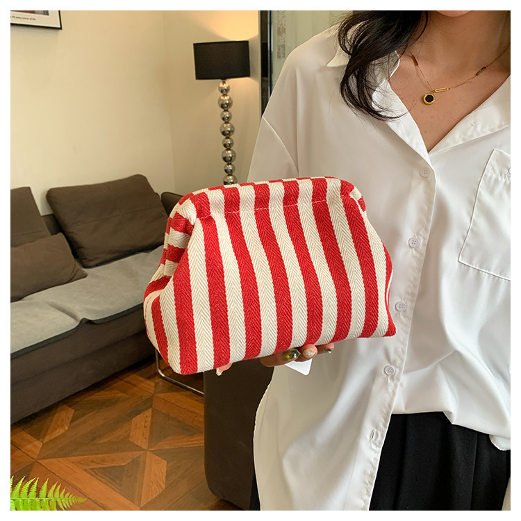 New cross-border fashion color-blocking striped cosmetic bag, women's loose change mobile phone storage bag, trendy and niche cloud clutch undefined