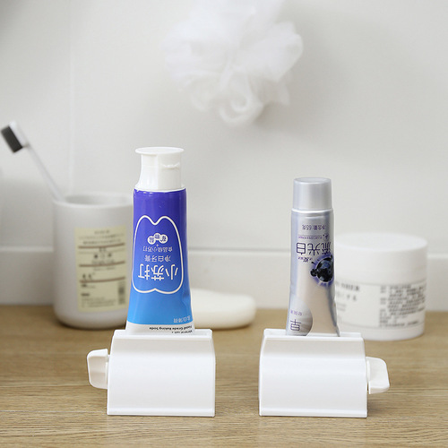 Japanese creative toothpaste squeezer facial cleanser storage rack children's toothpaste clip lazy manual toothpaste artifact