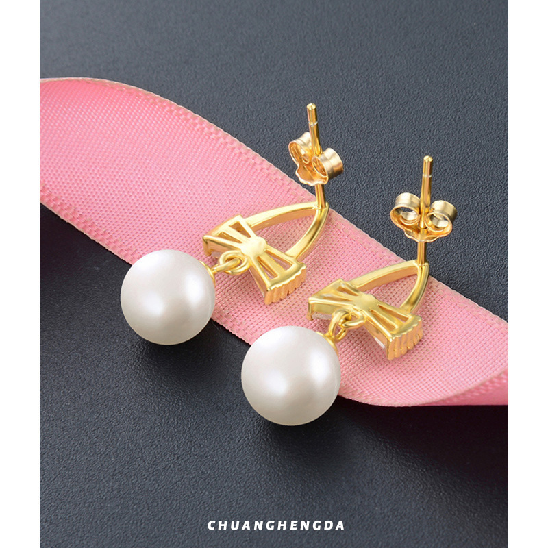 S925 plata esterlina perla arco pendientes ligero lujo temperamento de moda pendientes cortos 2022 nuevos pendientes de moda al por mayor