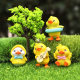 Cartoon raincoat little yellow duck micro landscape doll little duck baby doll creative car interior decoration small ornaments