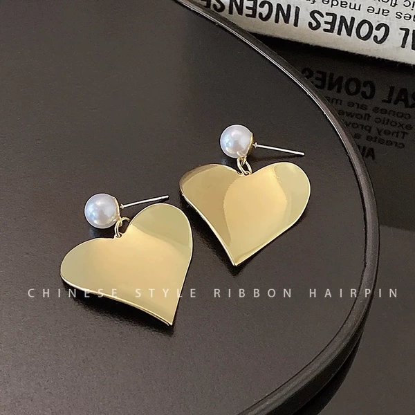 Glossy golden earrings